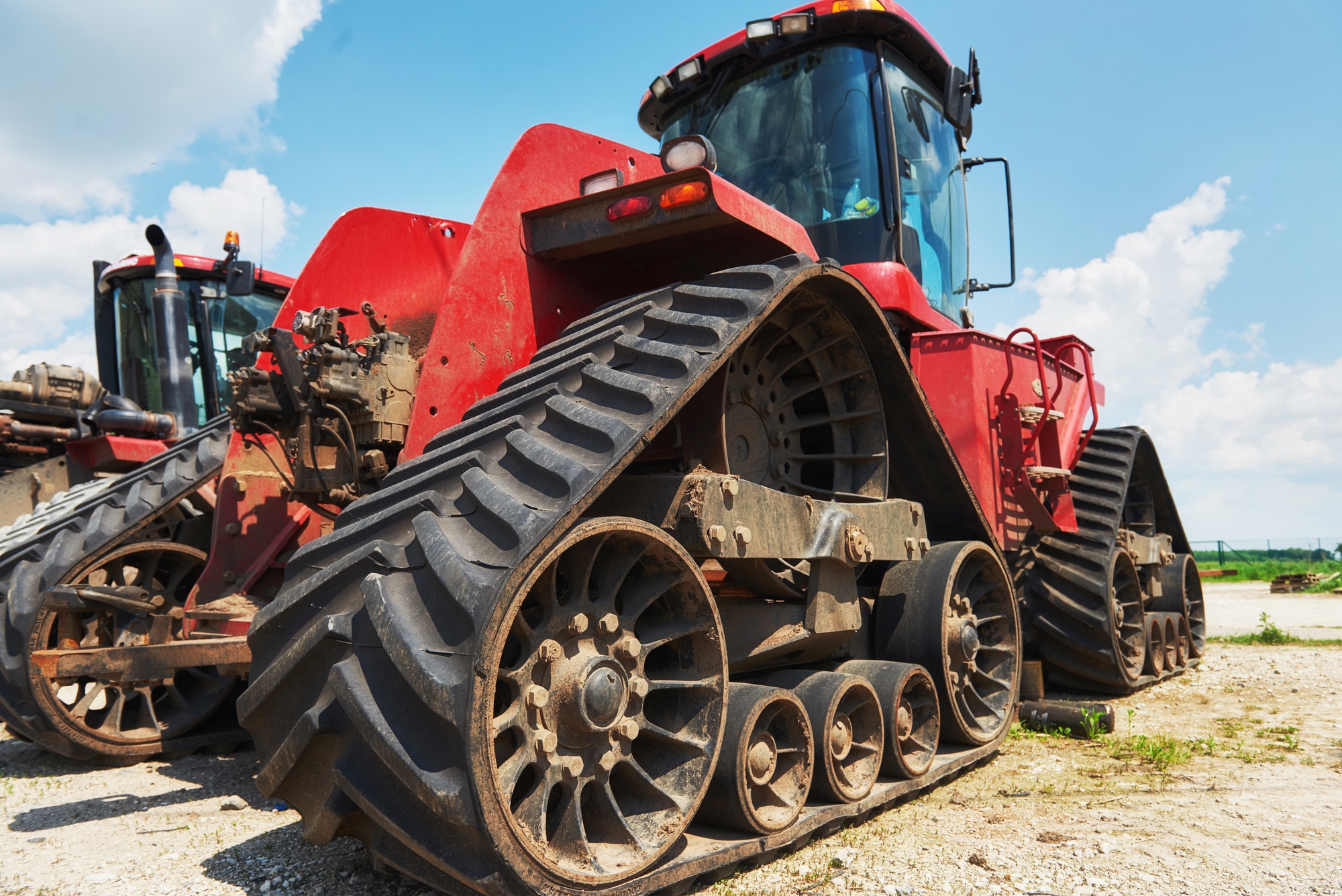 Harvesters and combine parts at the plant are waiting for sales, tractors and agricultural machinery